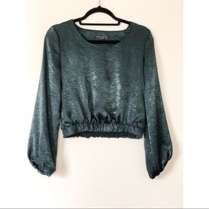 Green long sleeve top.